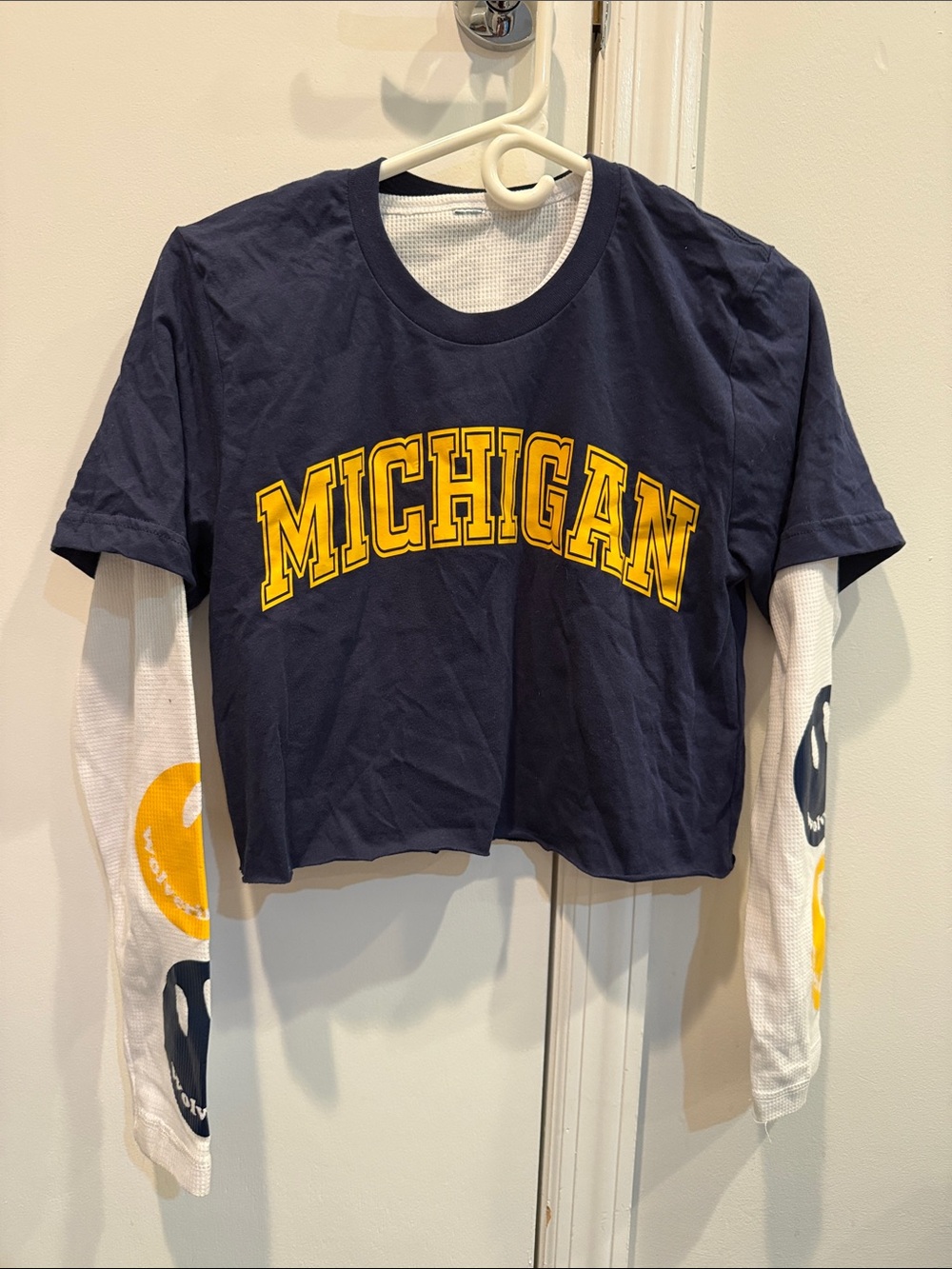 Univ. of Mich. cropped Navy Tee layered over white waffle graphic long sleeve.